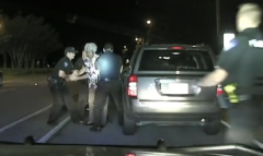 Officer attempting to arrest her for disorderly conduct.
